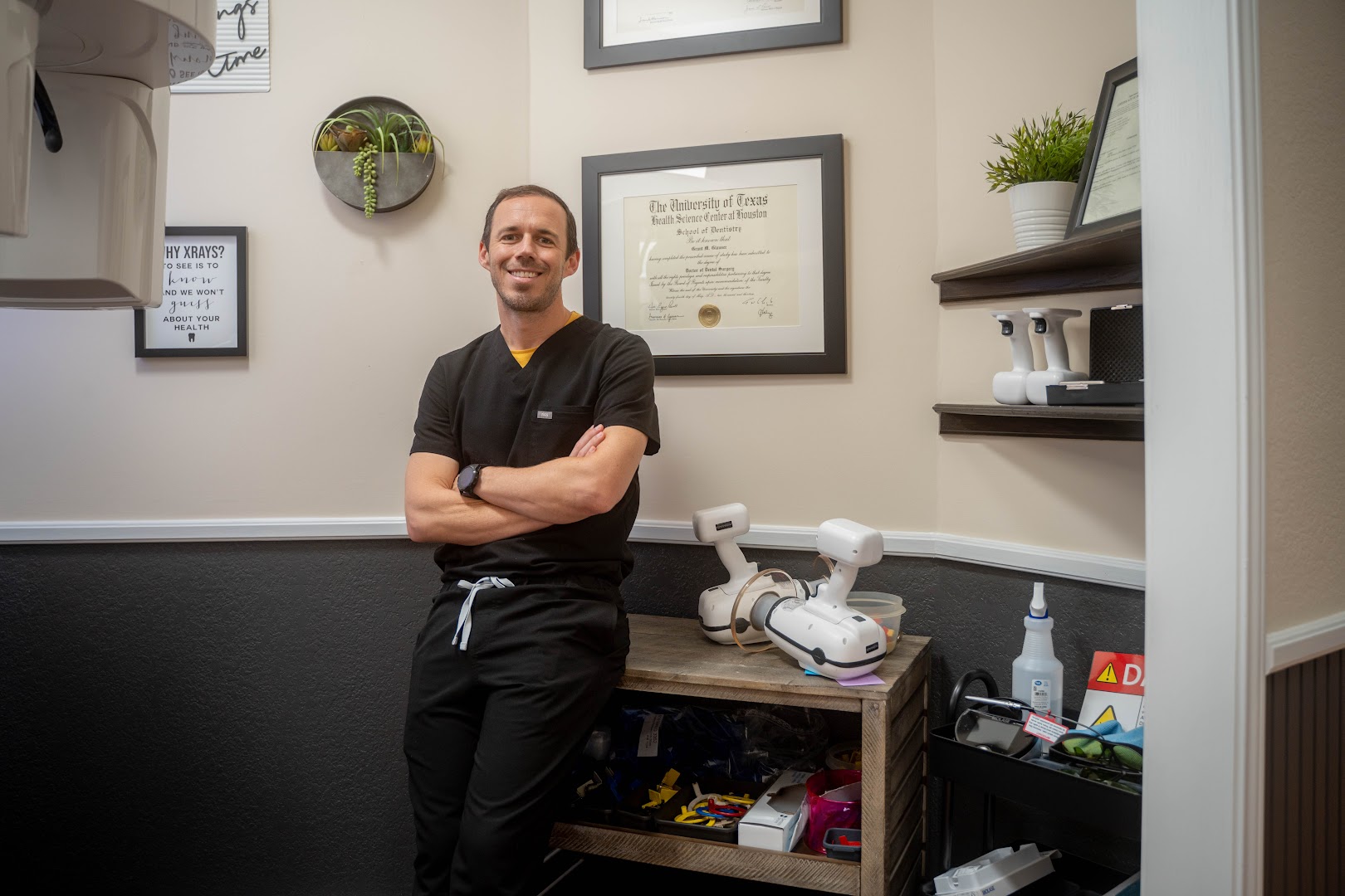 Dr. Grant Glauser standing in a treatment room beside digital imaging equipment